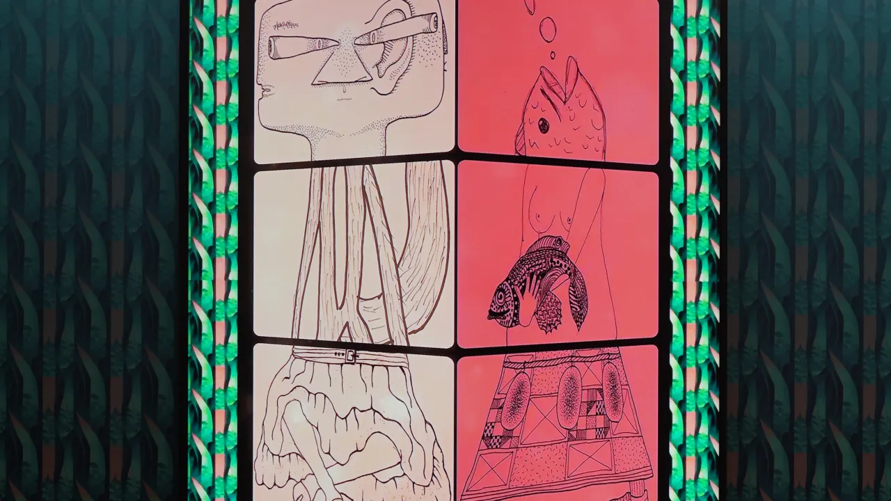 A framed graphic artwork is mounted on a wall. The framed piece features a three-dimensional cube shape divided into four sections. Two sections are a light beige color, while the other two are a pinkish-red. Each section of the cube contains an image showing various shapes, textures, and lines in varying shades of gray, black, and light colors. When pieced together e4ach cube section forms an unusual body. The frame surrounding the artwork is a teal or turquoise colour.