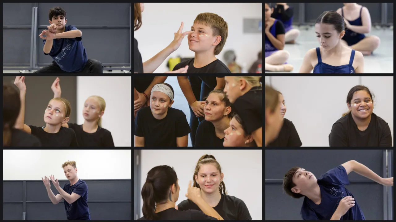 Nine rectangles form a Zoom-like grid showing young First Nations dancers. Most are captured mid-movement in navy blue and black dancewear, two have ochre face paint, and the central rectangle shows several dancers sitting together, watching something intently.