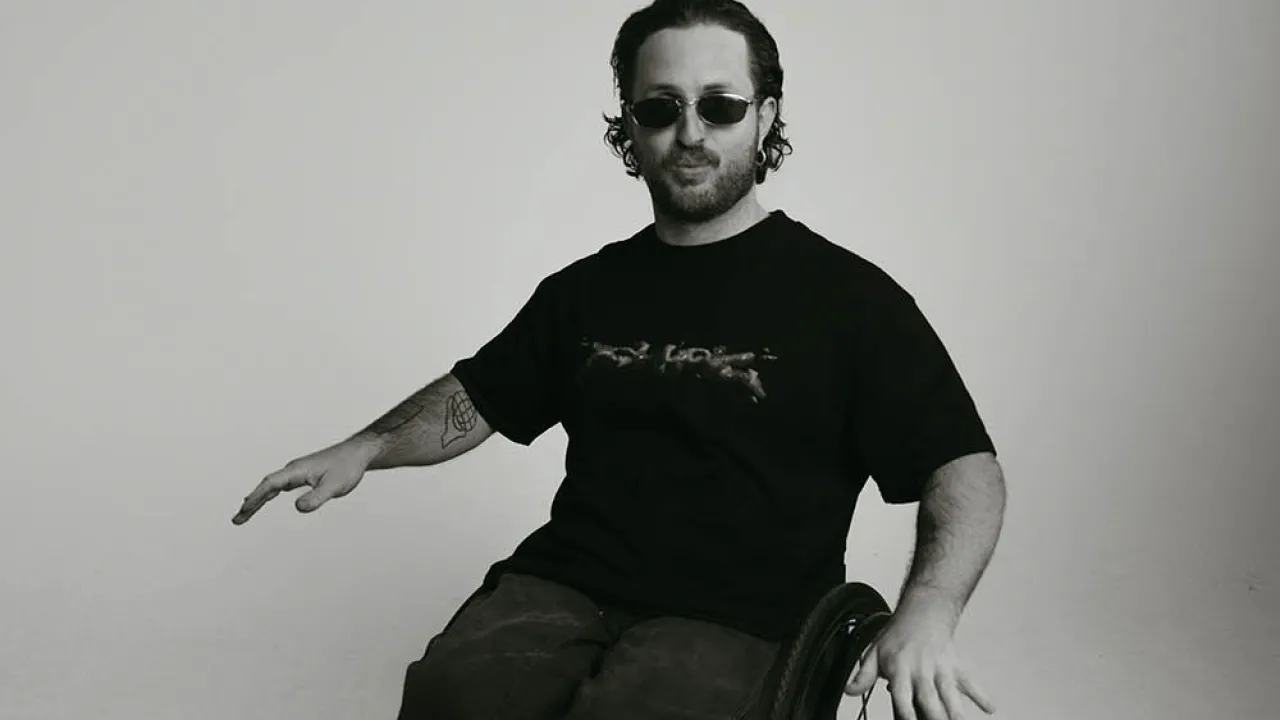 DJ in black clothes and a wheelchair