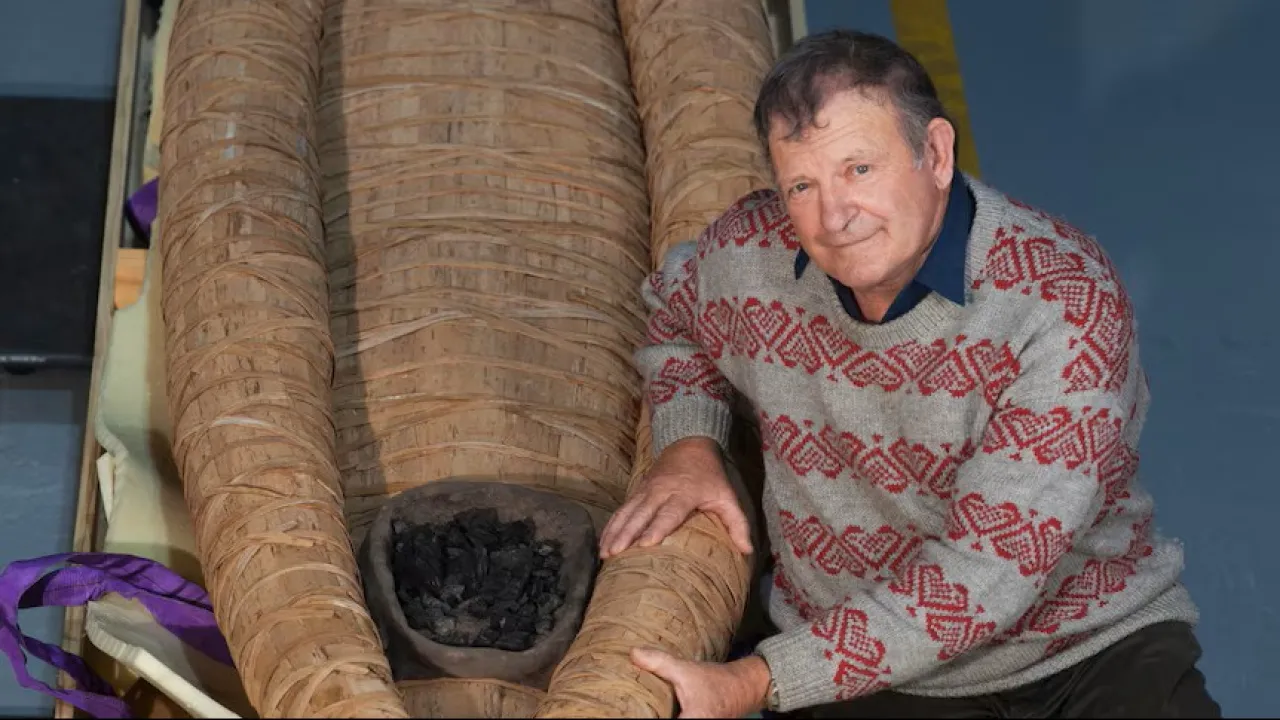 Uncle Rex Greeno with his traditionally made Tasmanian Aboriginal bark canoe