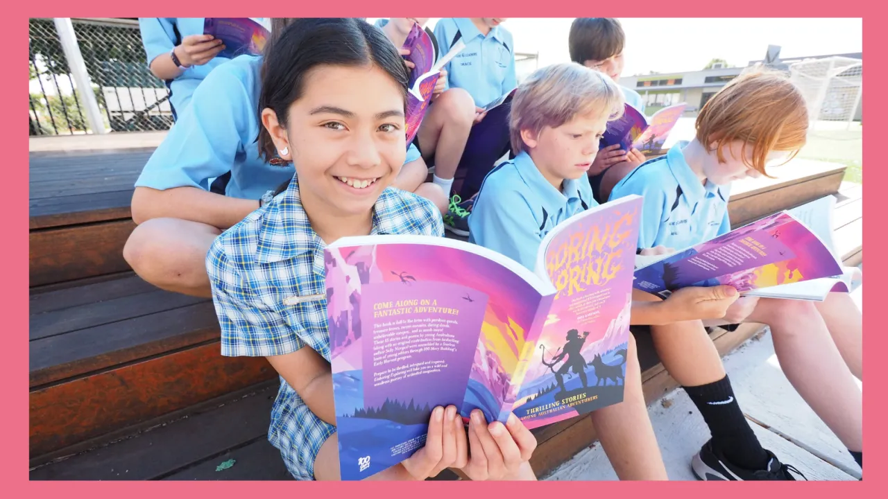 6 or 7 Newport Primary school children happily reading outside