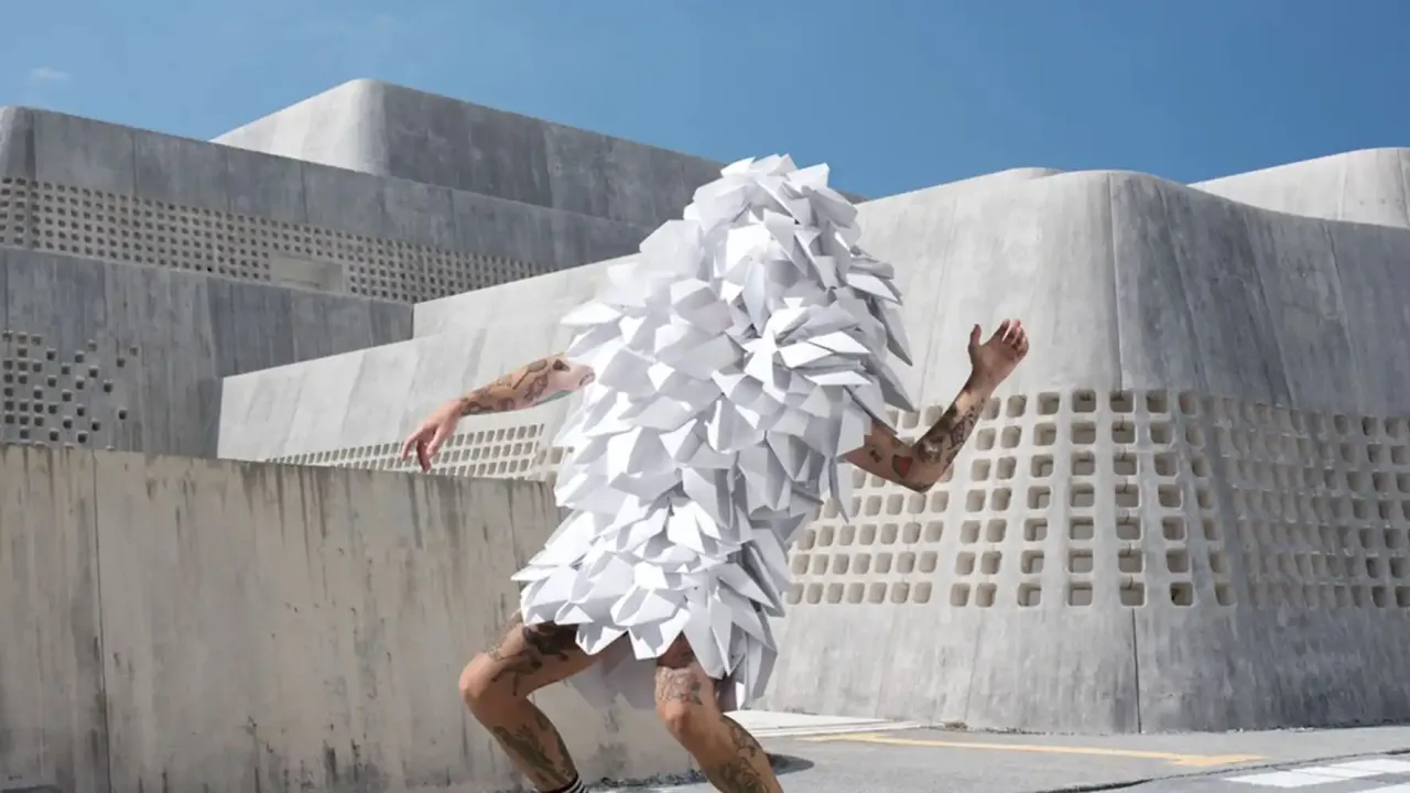 Illustrative. Dancer in white tasselled costume