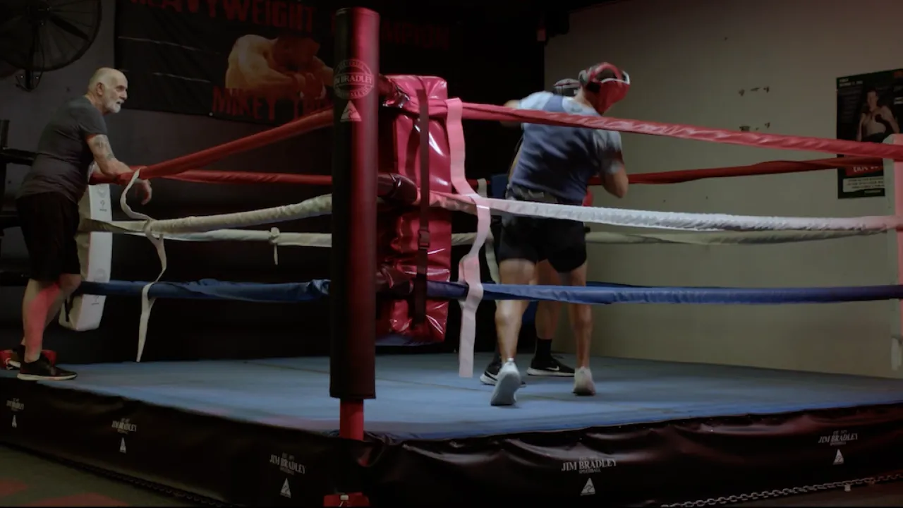 A still image from Thunder feature film about boxing. Featured are two boxers in a ring with a ref. Photography by Tom Conyers for Luke Styles.