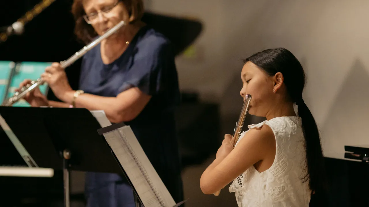 Photograph of AMEB consultant Jocelyn Fazzone and flute student performing at the AMEB Flute grade book launch (Credit: Kate Disher-Quill)