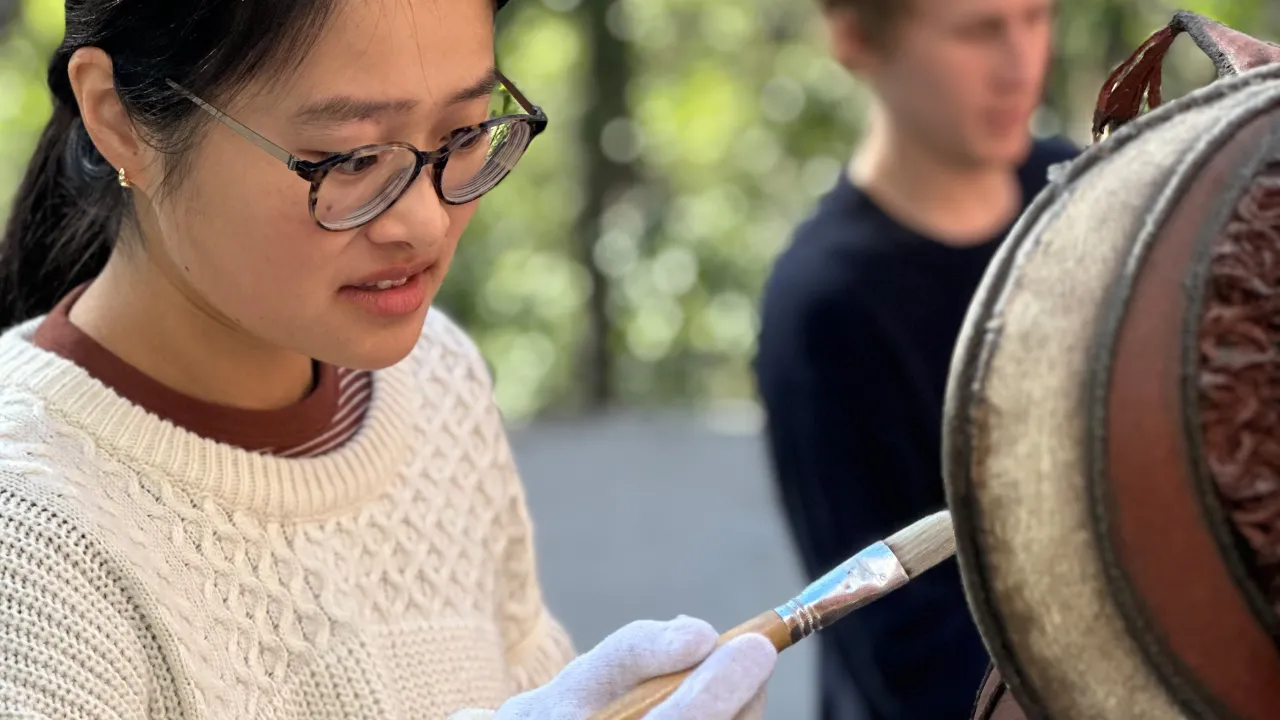 Griffith University Art Museum student interns undertaking training in preventative conservation