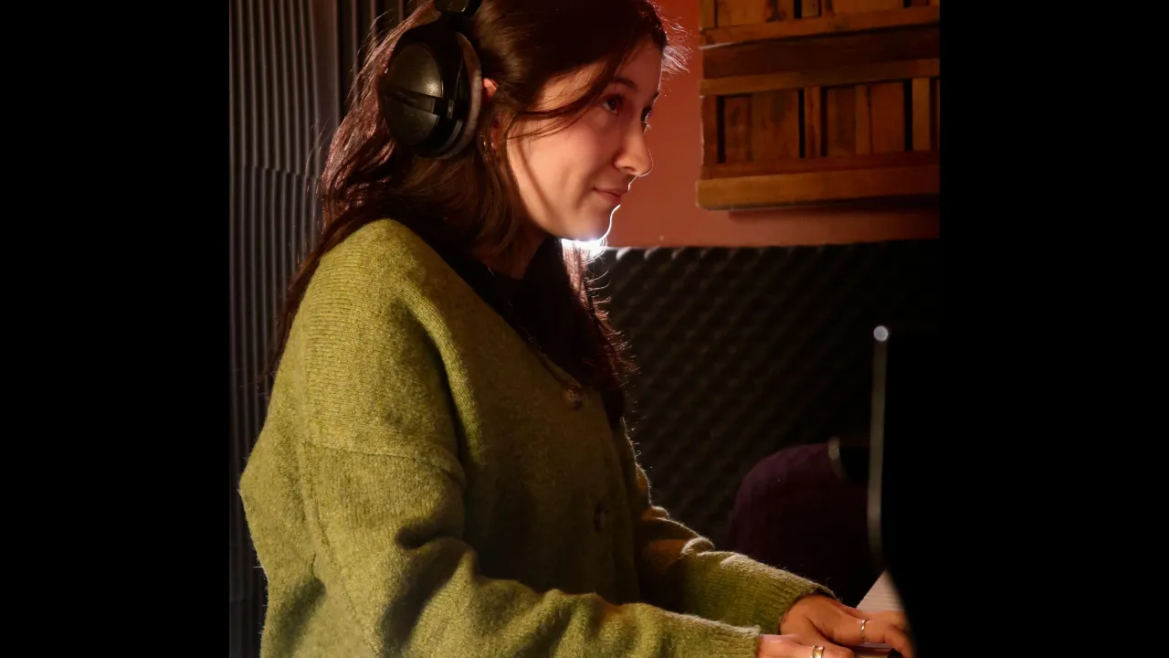 Composer Ayda Akbal playing the piano at her previous album's recording session.