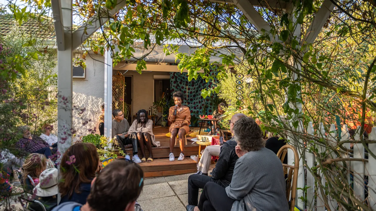 A storyteller shares their story with an audience at Centre for Stories’ Backstories event in Nollamara, 2022. 