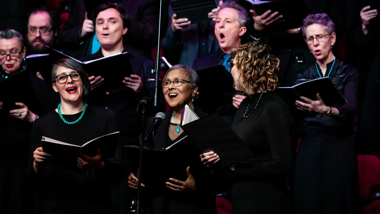 River City Voices singers performing in our Human Waves concert in 2025