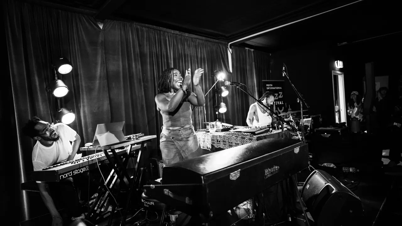 Melanie Charles and her band in between songs 