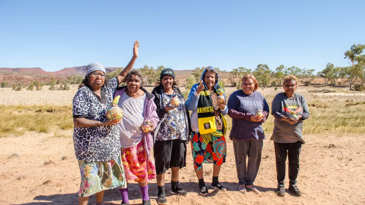 6 members of Hermannsburg Pottes with their pots on Country