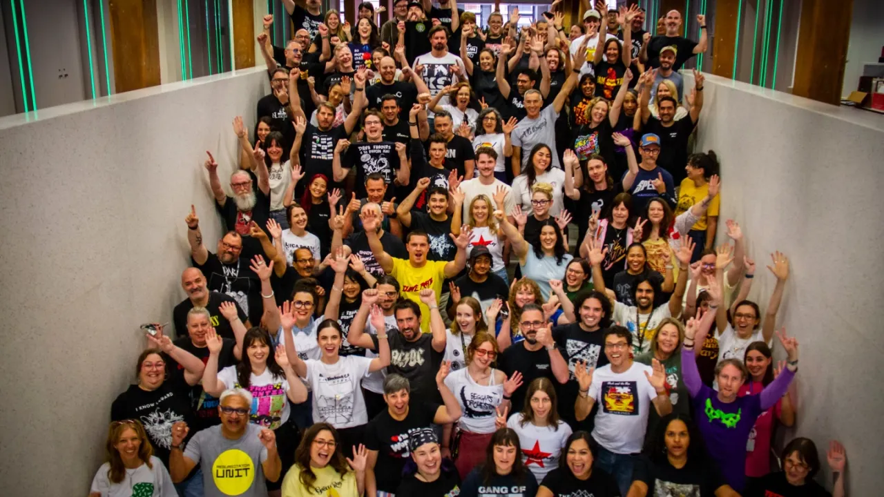 APRA AMCOS team on stairs wearing AusMusic t-shirts