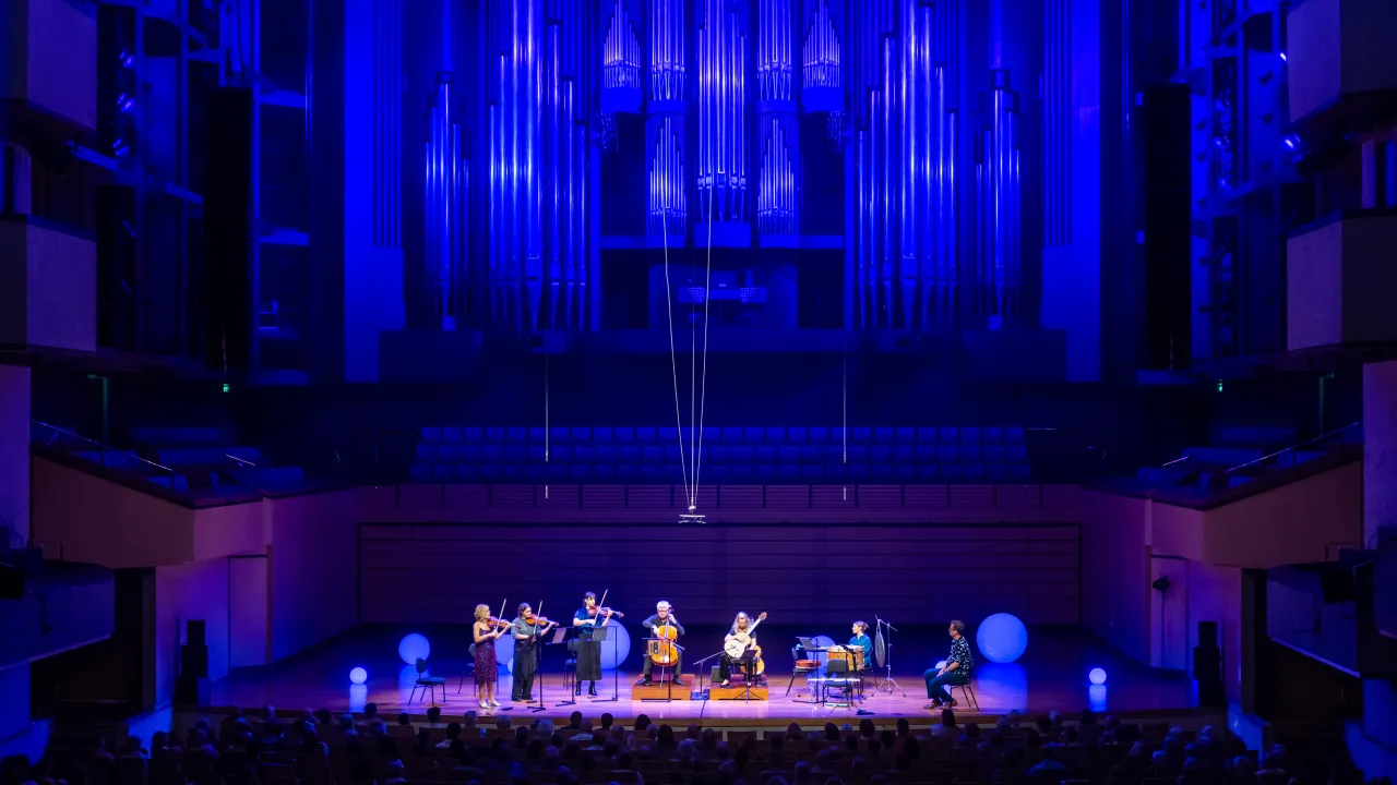 An image of a small group of musicians on stage at the Concert Hall in QPAC. 