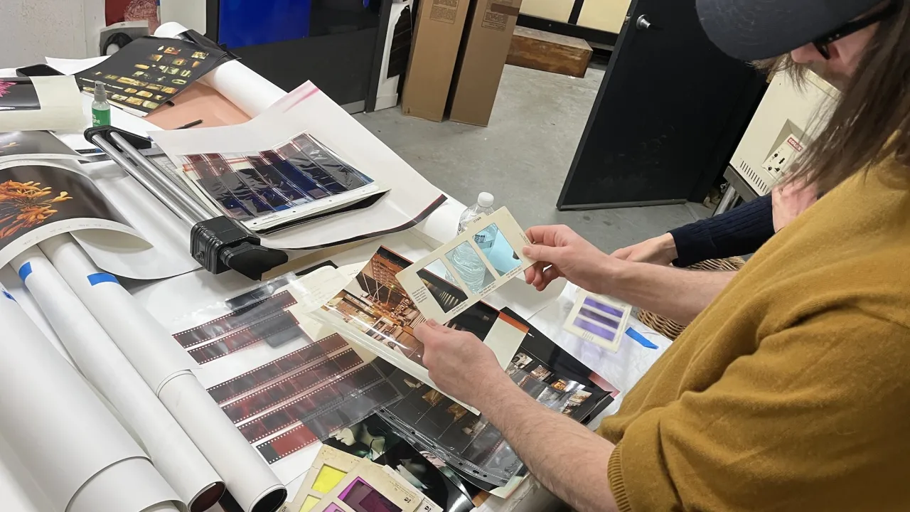 artists checking colour balance in the photo lab