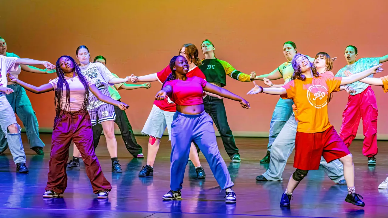 Students from different secondary schools all over Canberra are dancing a joyful afro hip hop work on the stage of Canberra Theatre Centre