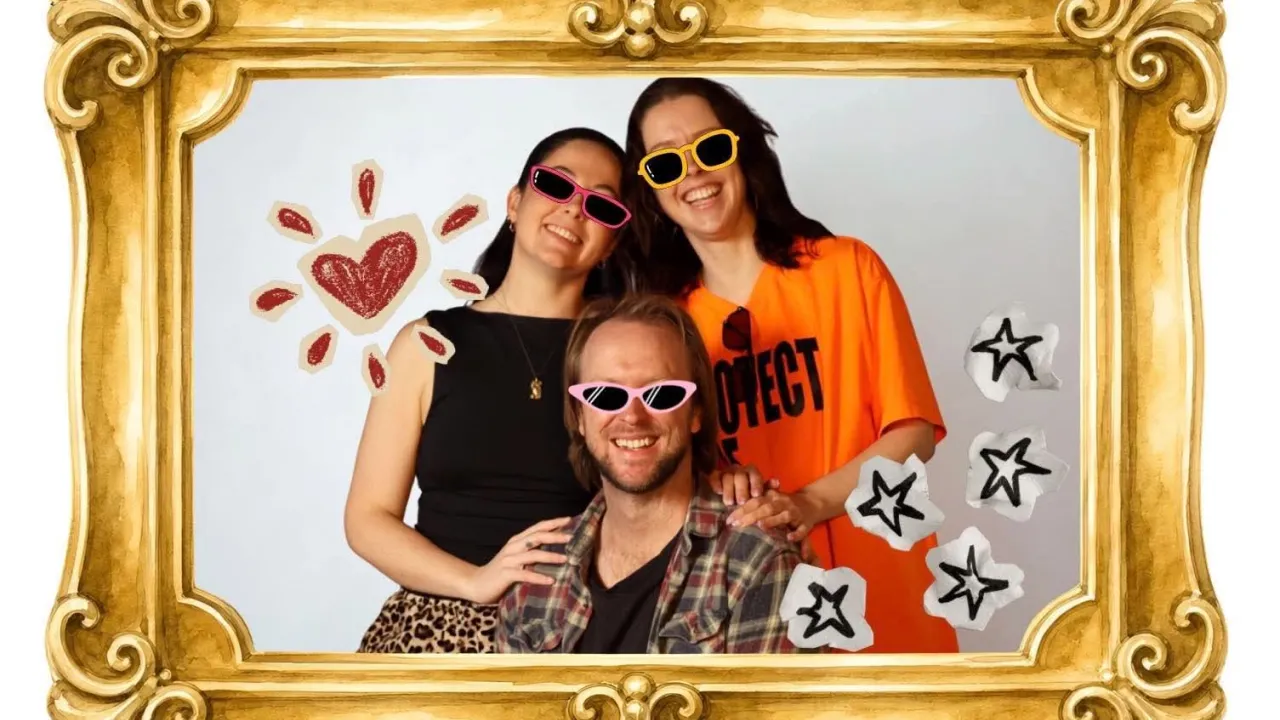 The 3 founders of Yeah Nah Theatre, Meg Bowden, Mikayla Hosking, and Campbell Lindsay are posing family portrait style. Glasses are hand-drawn on their faces, with love hearts and stars floating nearby. Reminiscent of something you would see on your mum's fridge