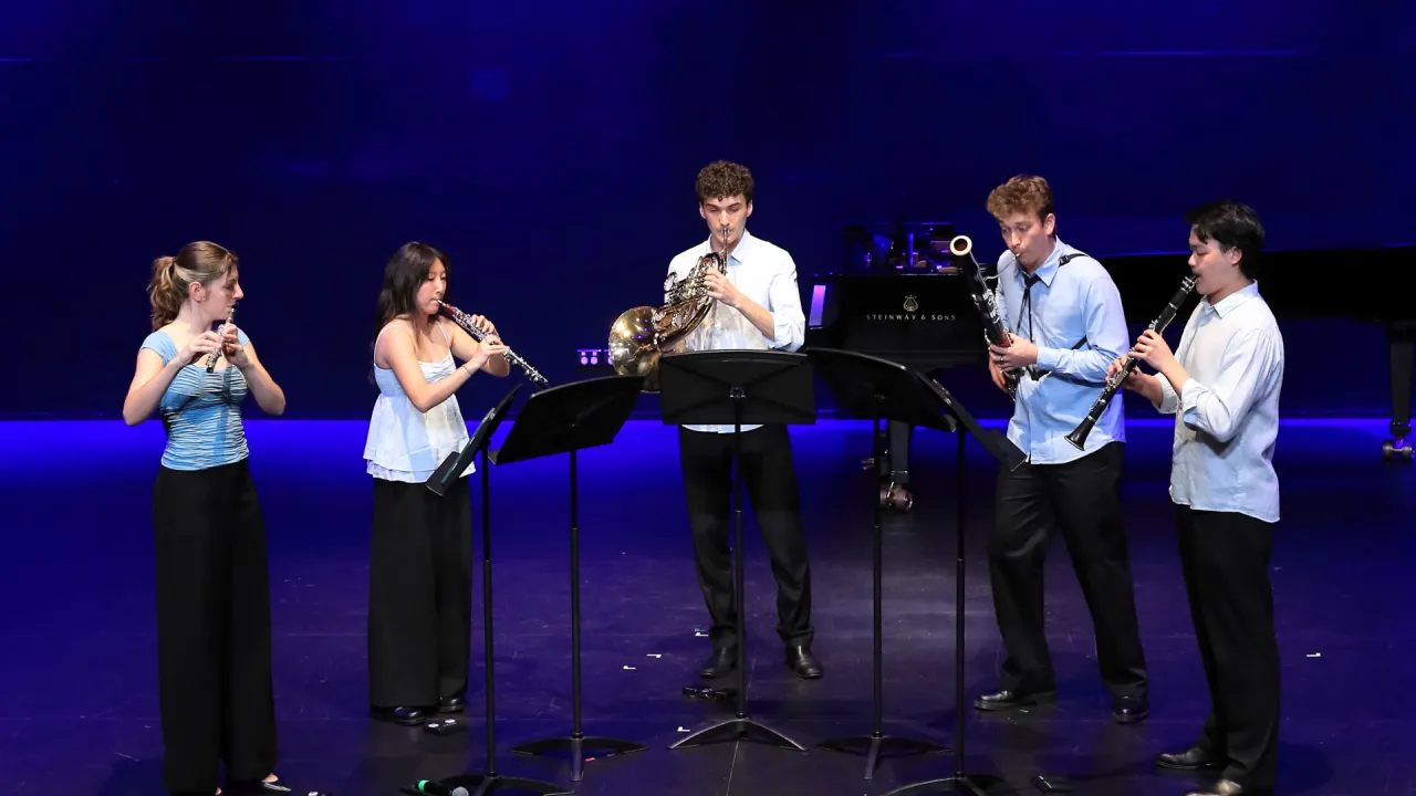 The Orpheus Quintet performing on stage at the Australian Festival of Chamber Music. Left to right: Kara Thorpe (flute), Gahyun Lee (oboe), Jude Austen Kaupe (French horn), Dylan Roberts (bassoon) and Justin Wang (clarinet).
