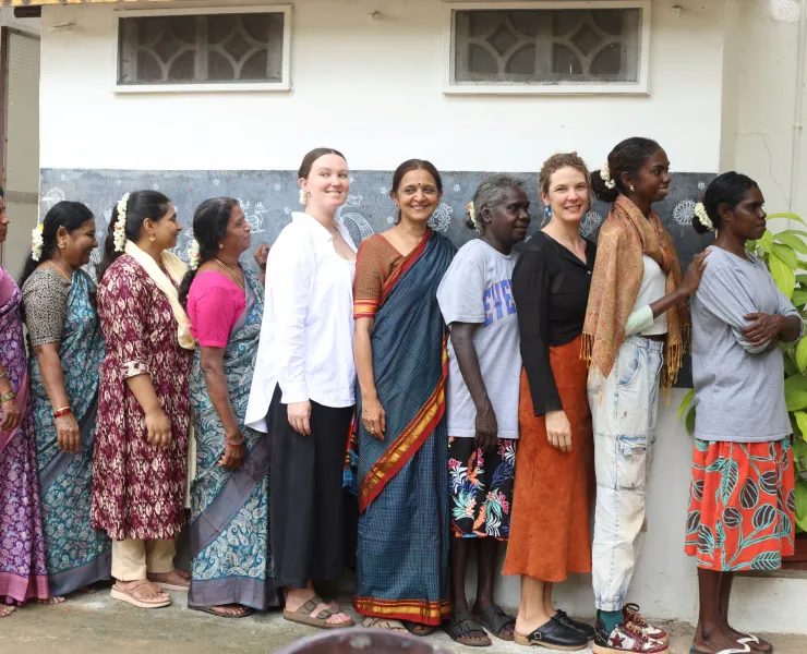 Members of the Bábbarra Women’s Centre and Tharangini Studio standing together