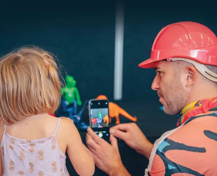 Child with a man in a hard hat